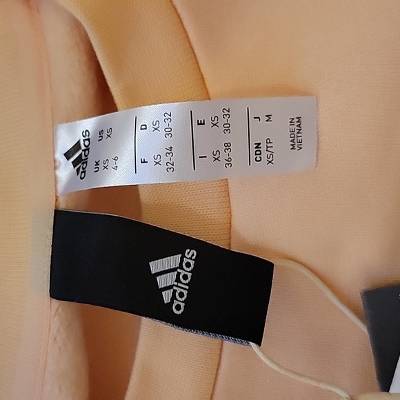 NWT Adidas Glam ID Peach Pastel Sweatshirt XS Soft Gold Logo Athleisure Chic - Picture 9 of 10